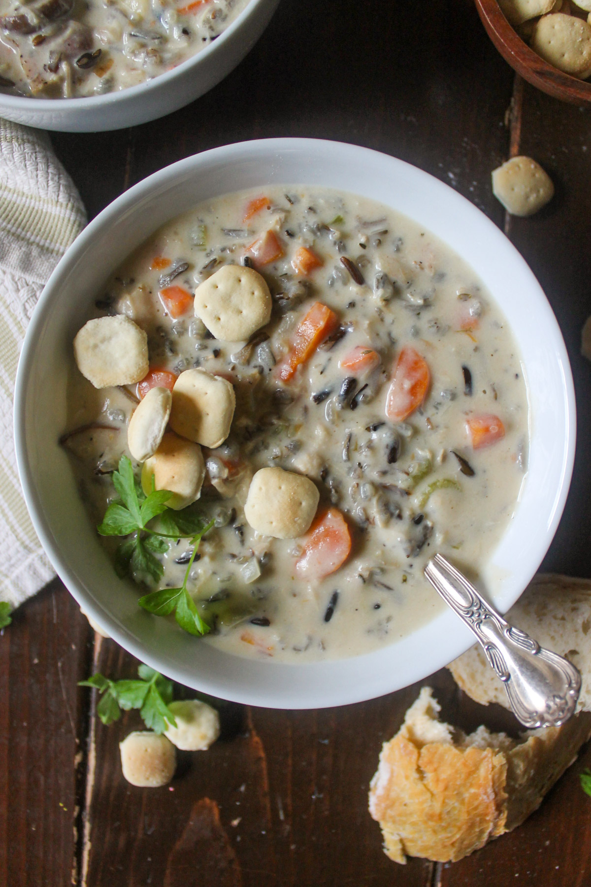 A bowl of Minnesota Wild Rice Soup with crackers.