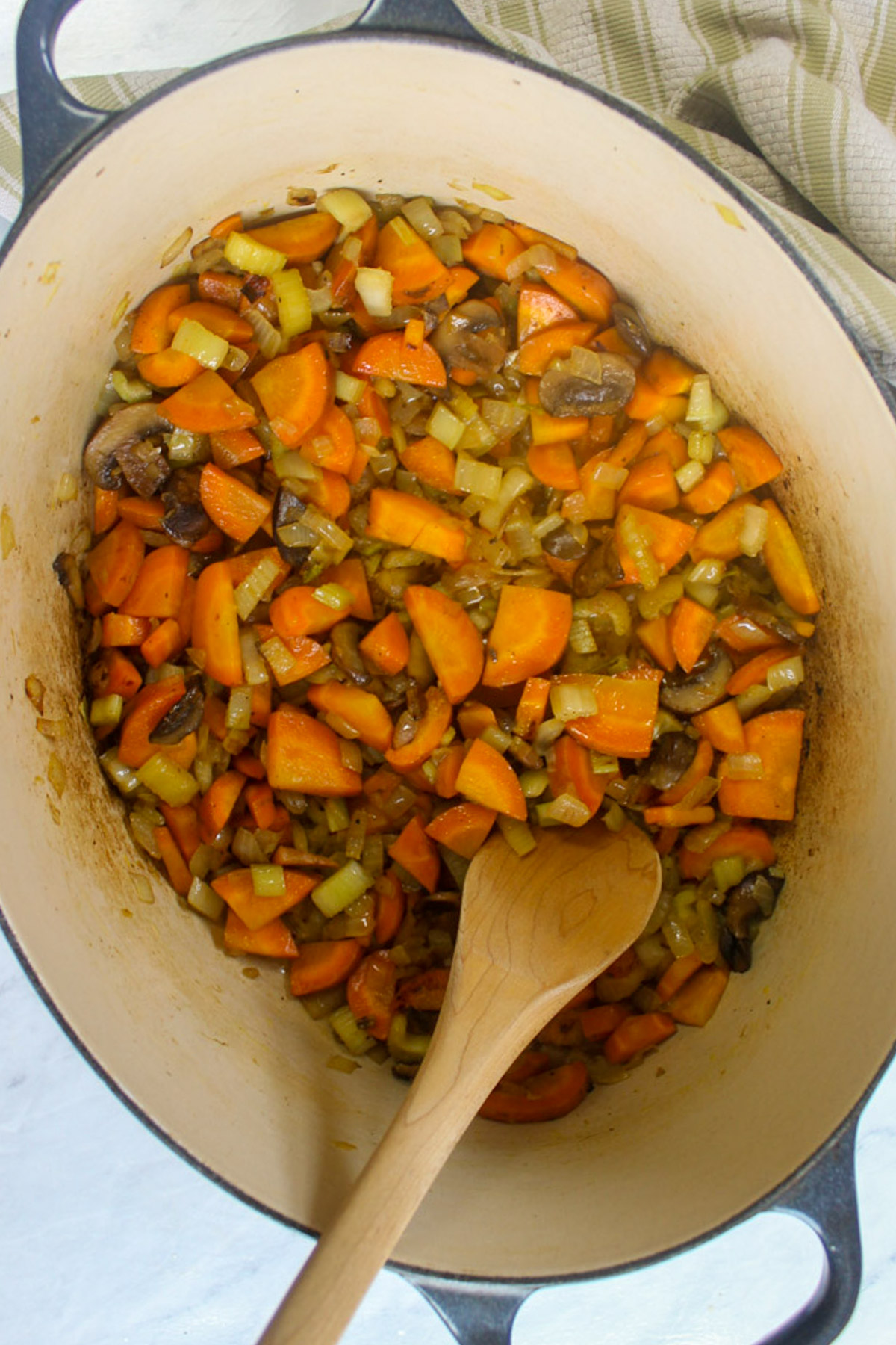 Sautéing vegetables in a soup pot.