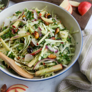 Crispy and healthy fall harvest slaw salad with apples and kale.