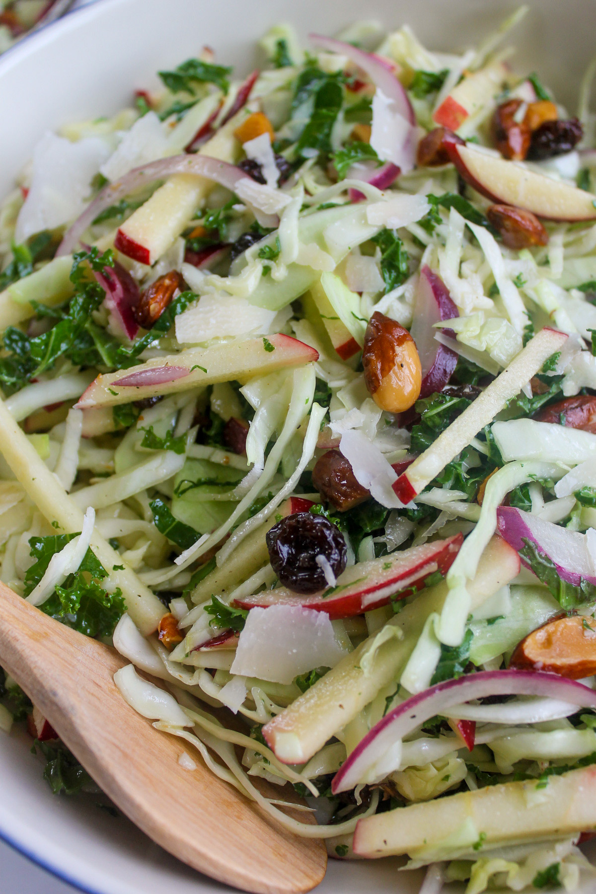 Autumn crunch salad with kale, apples, and sweet honey cider dressing.