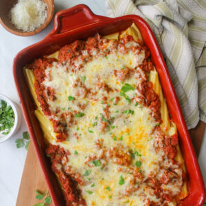 Cheesy manicotti with meat sauce.