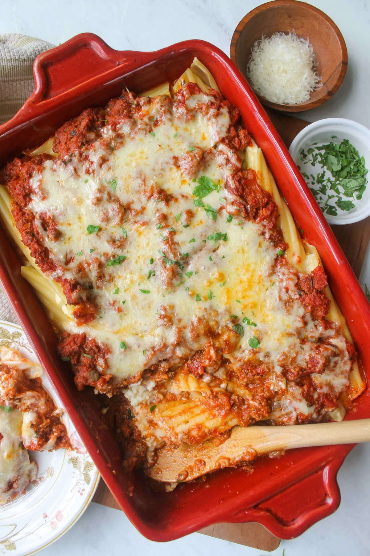 A large pan of baked manicotti with hidden veggies and meat sauce.