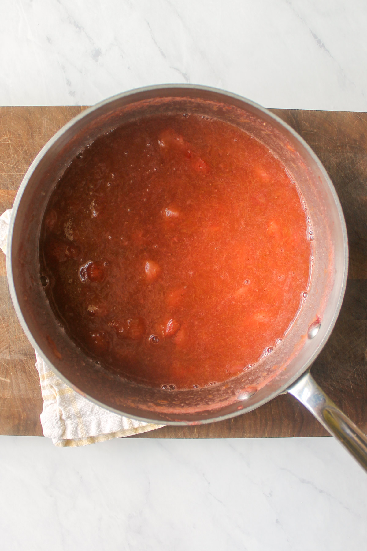 The cooked strawberry rhubarb sauce in a pot, ready to be blended.