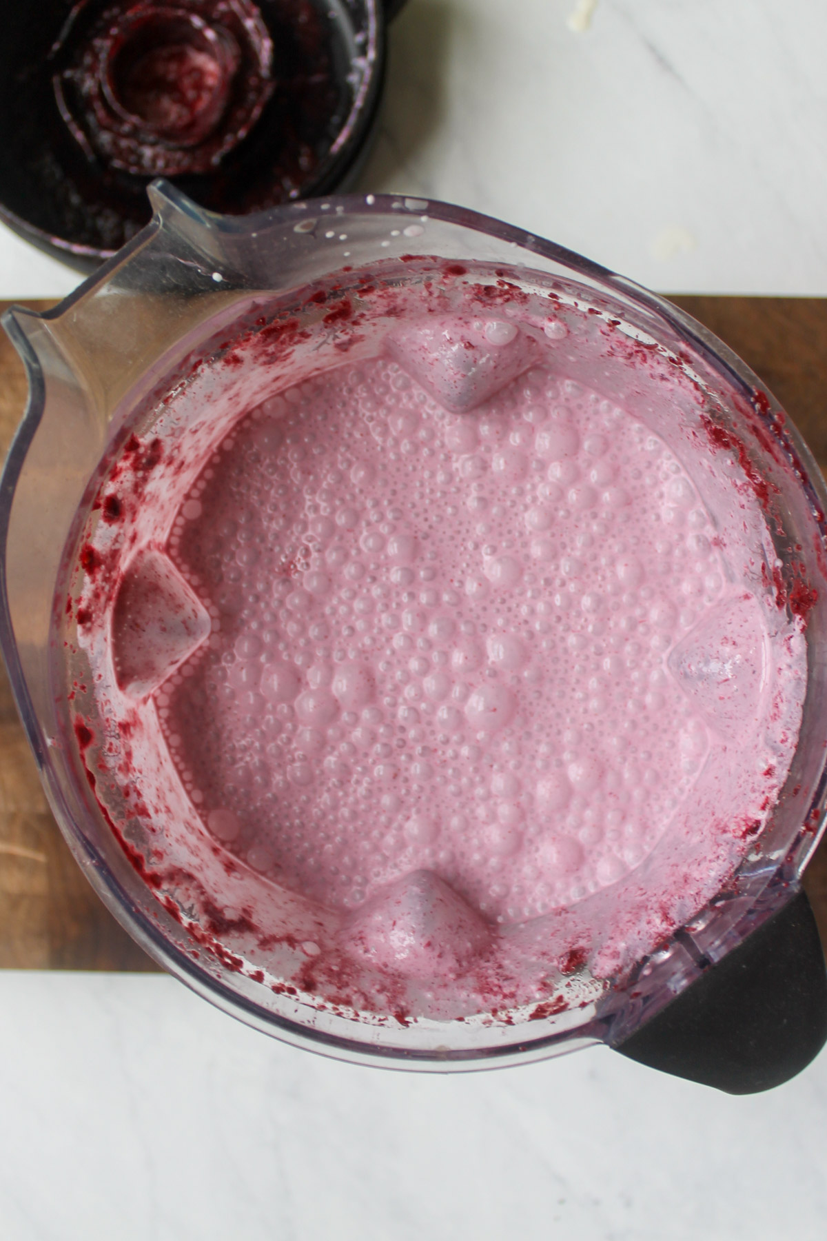 Cream and milk added to blended mulberries for a light pink color.