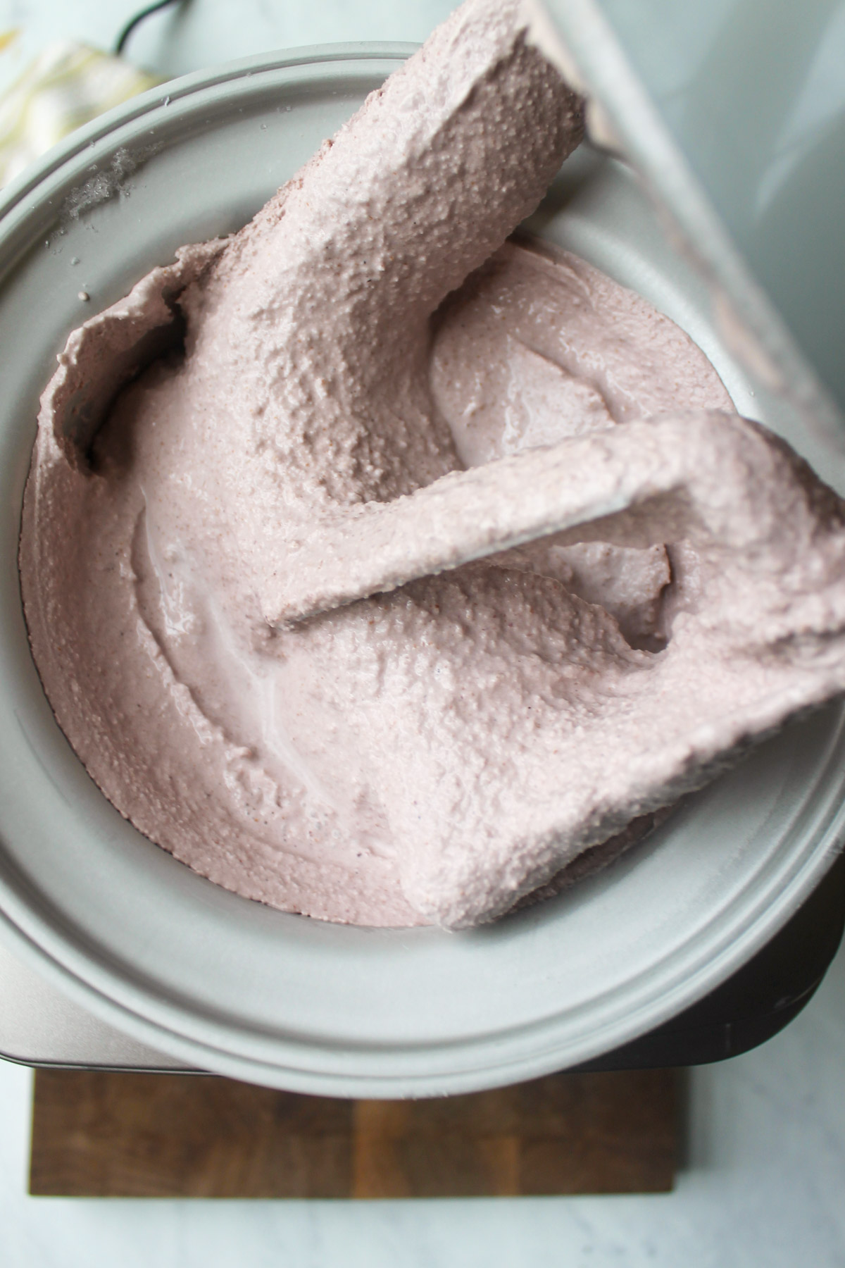 Mulberry ice cream churned in an ice cream maker.