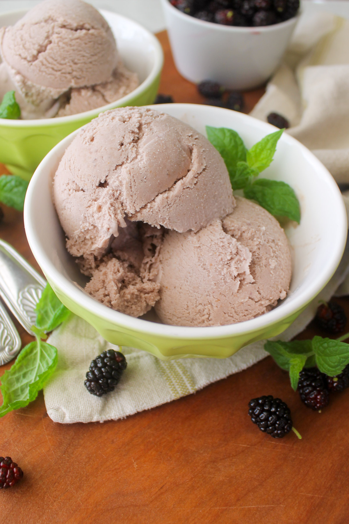 Green bowls of mulberry ice cream.