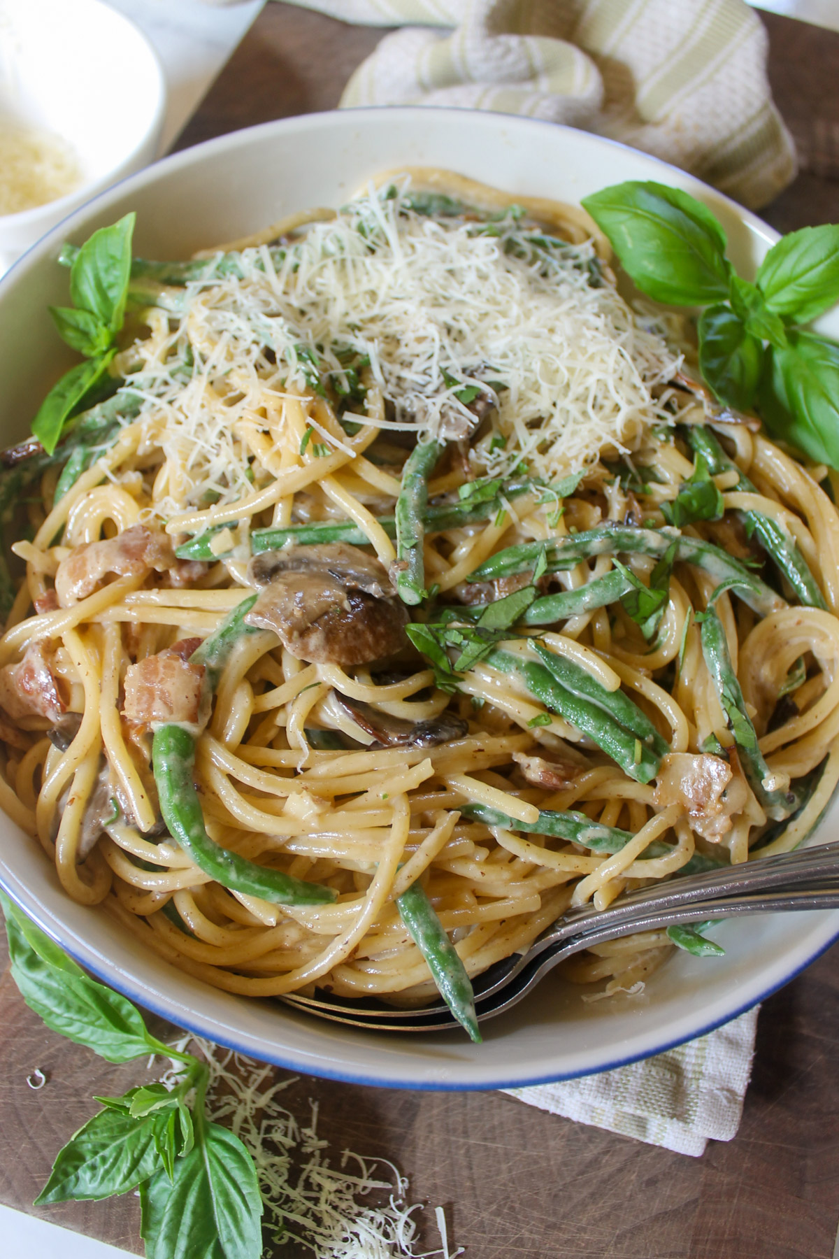 Spaghetti with garden green beans in a creamy mushroom sauce.