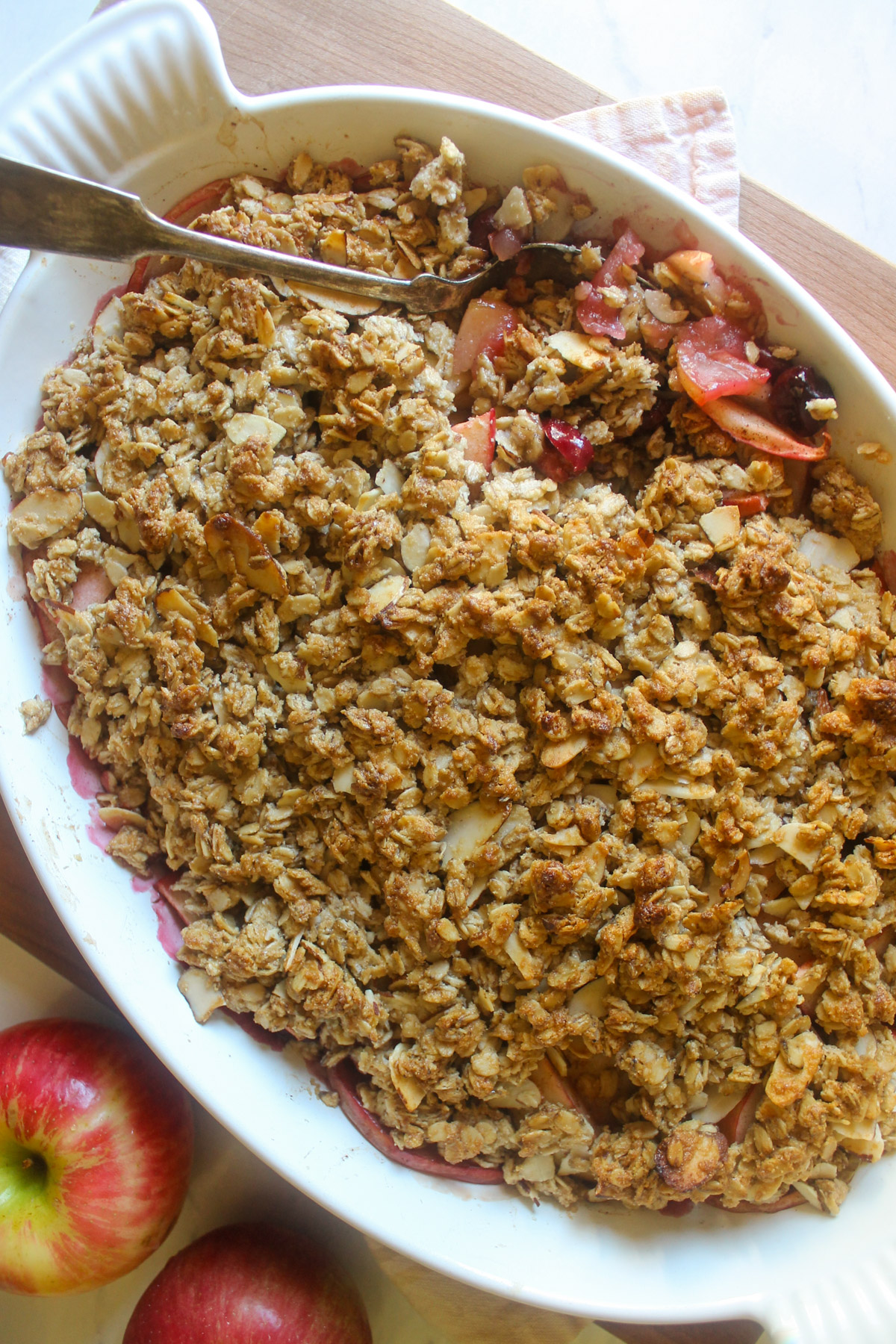 Baked Apple Cherry Crisp scooped with a spoon.