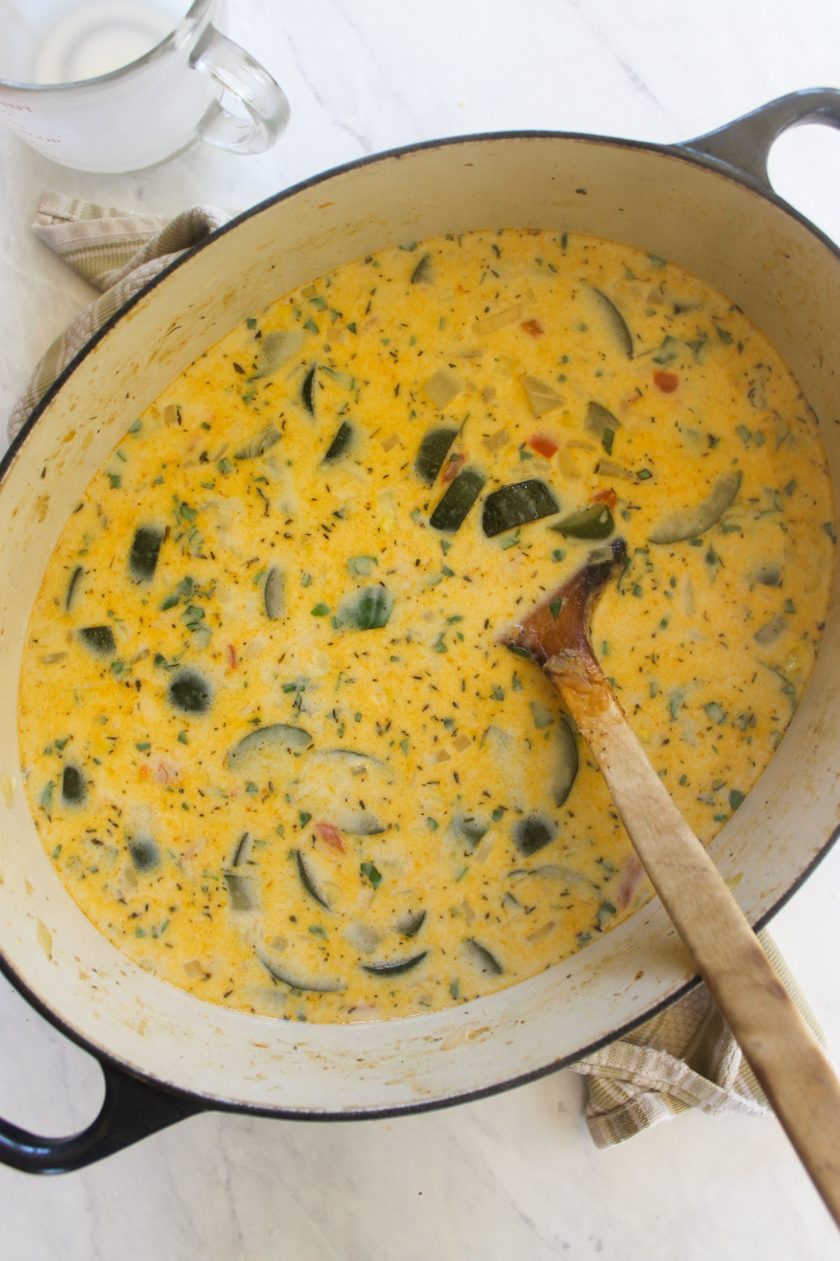 Zucchini corn chowder soup ready to simmer and thicken.