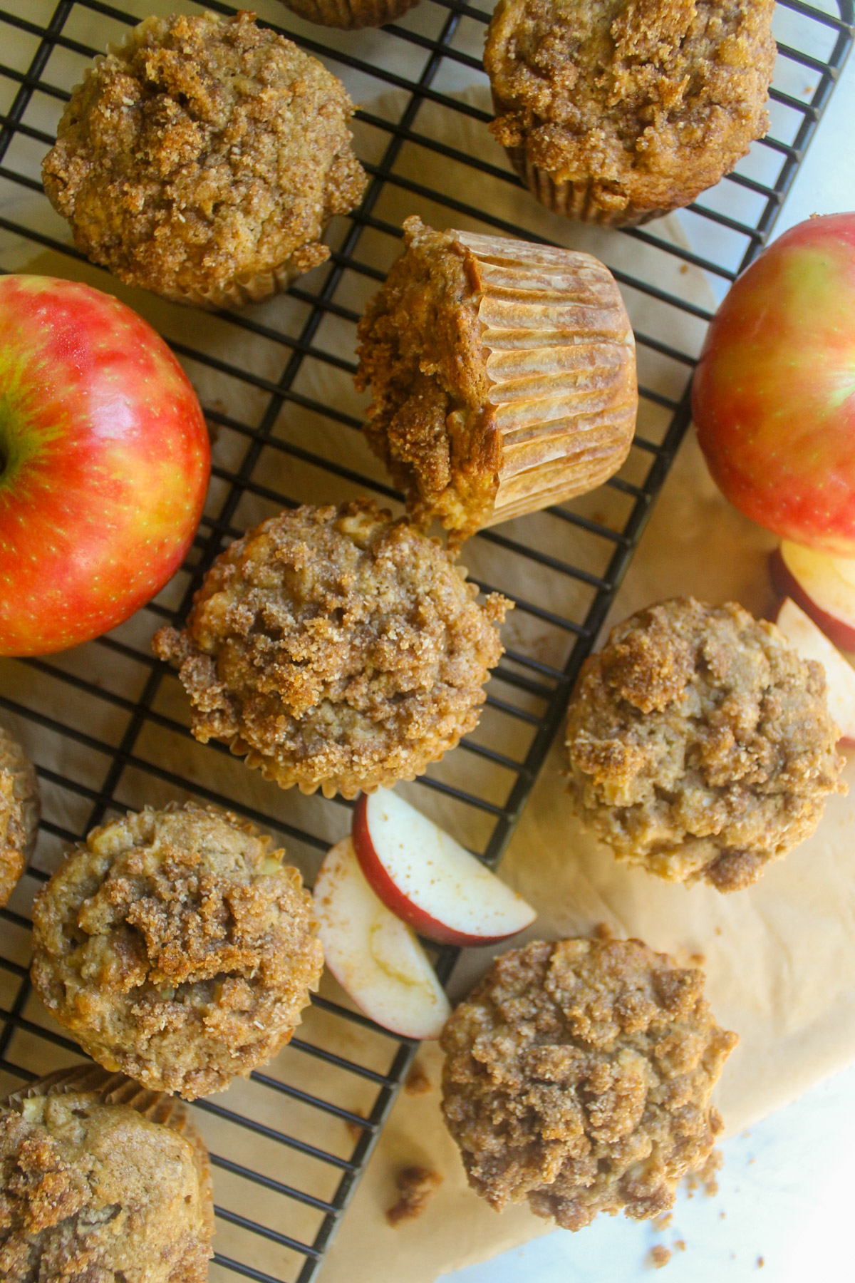 Apple muffins on a wire rack.