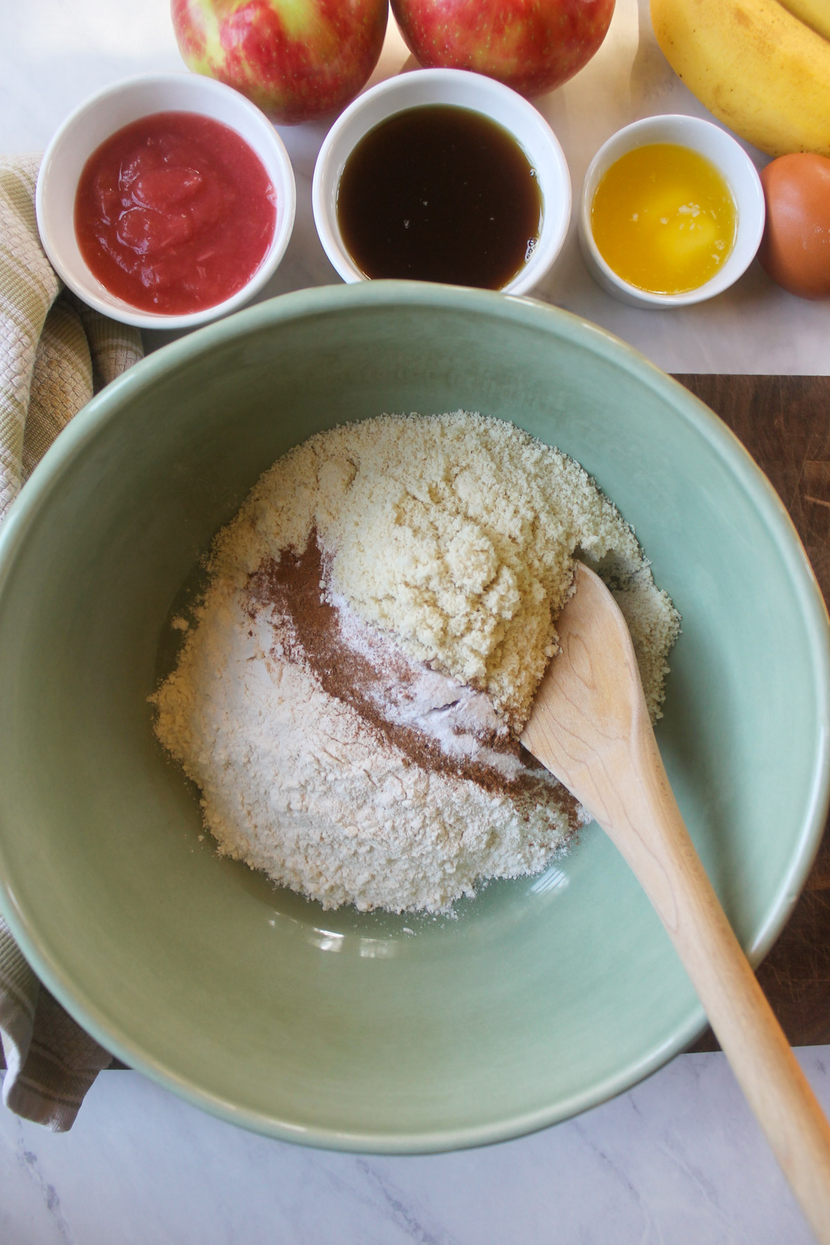 Dry ingredients for apple muffins in a bowl.