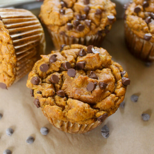 Banana Pumpkin Muffins on parchment paper.