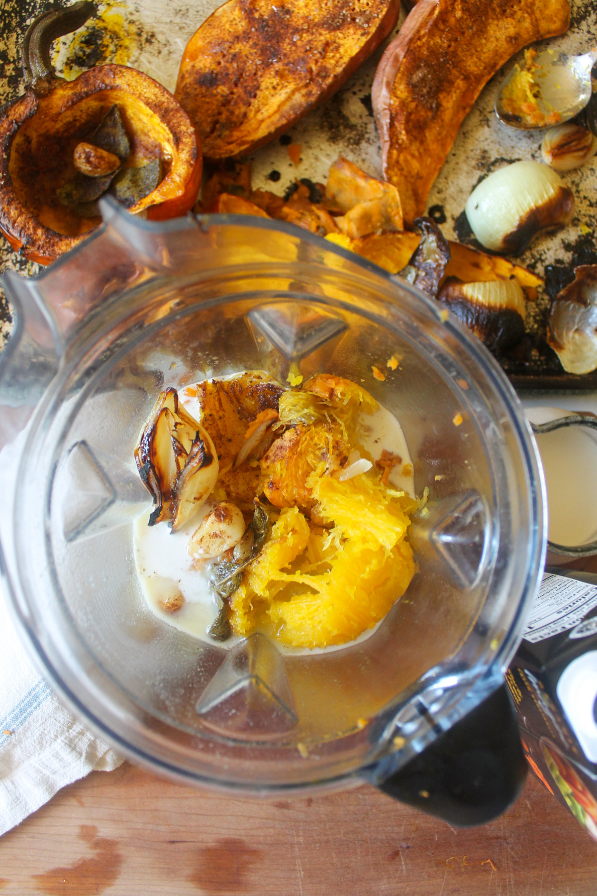 Roasted pumpkin and sweet potato in a blender with onion, garlic, stock and cream.