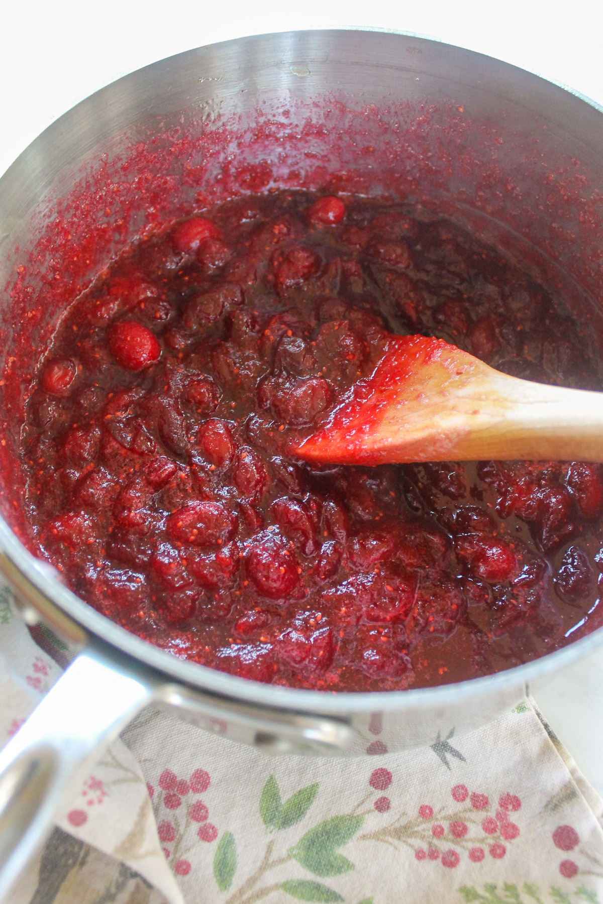 Thickened cranberry honey sauce in a sauce pan.