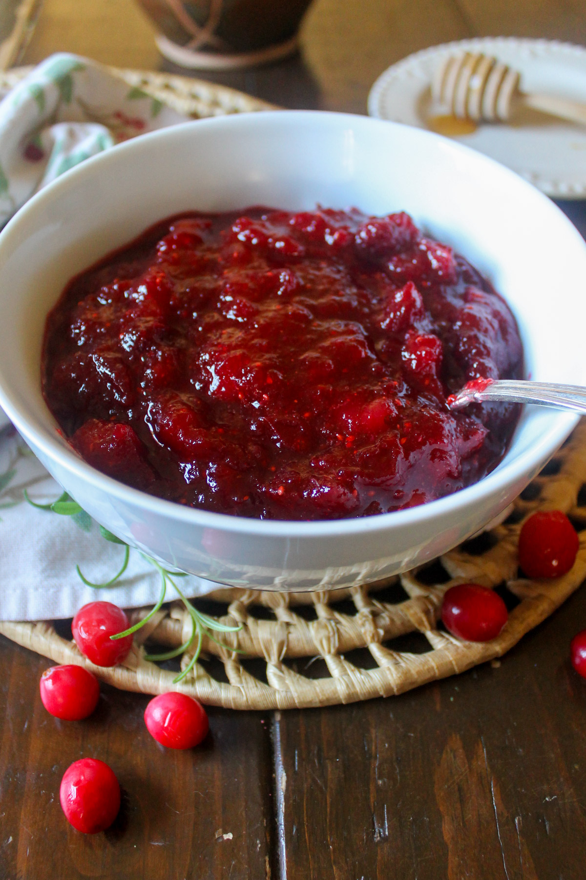 A bowl of cranberry sauce with honey.