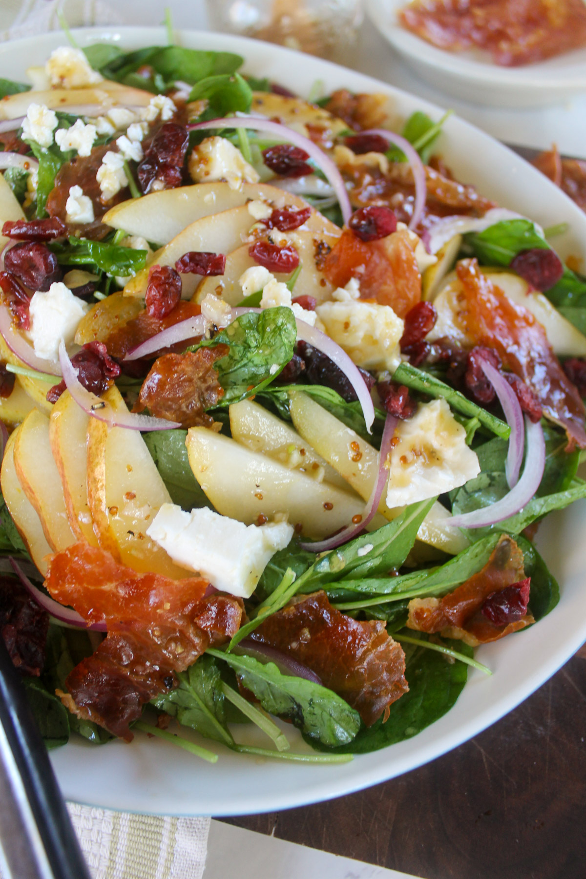 Arugula Pear Salad with honey red wine vinaigrette dressing.