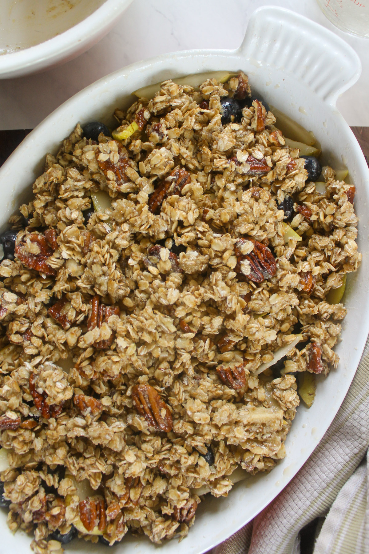 An unbaked Pear Blueberry Crisp.