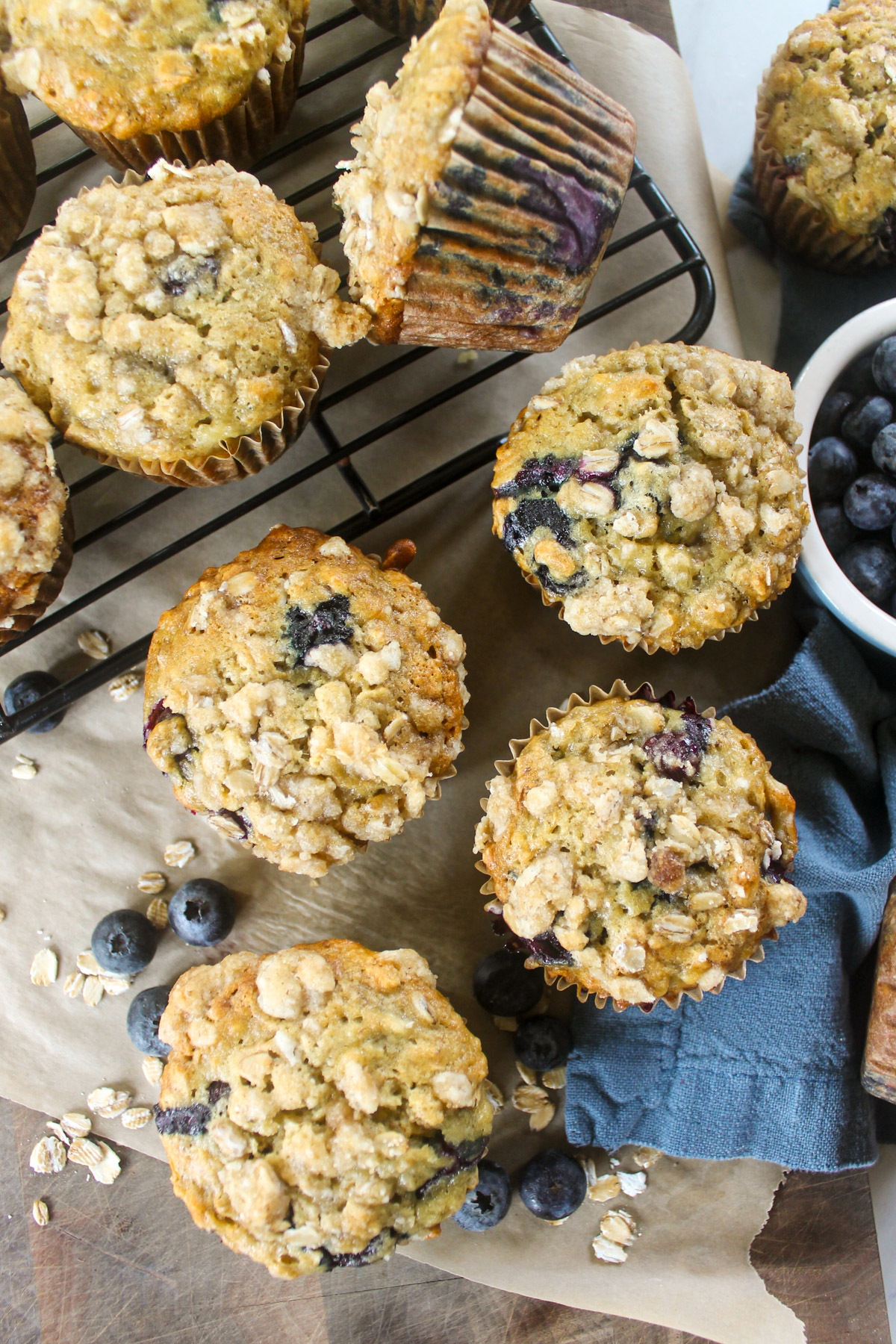 Blueberry Banana Oat Muffins on a wire rack.