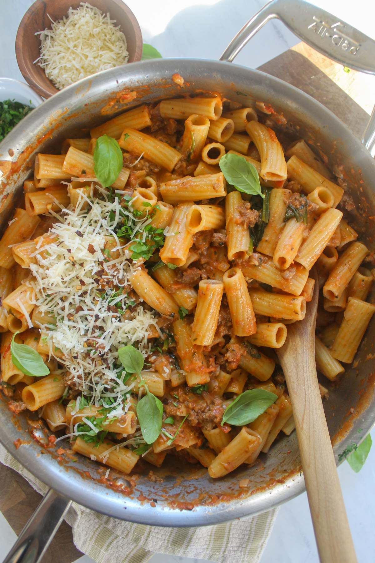 Spicy Rigatoni with Meat Sauce in a skillet with Parmesan cheese.