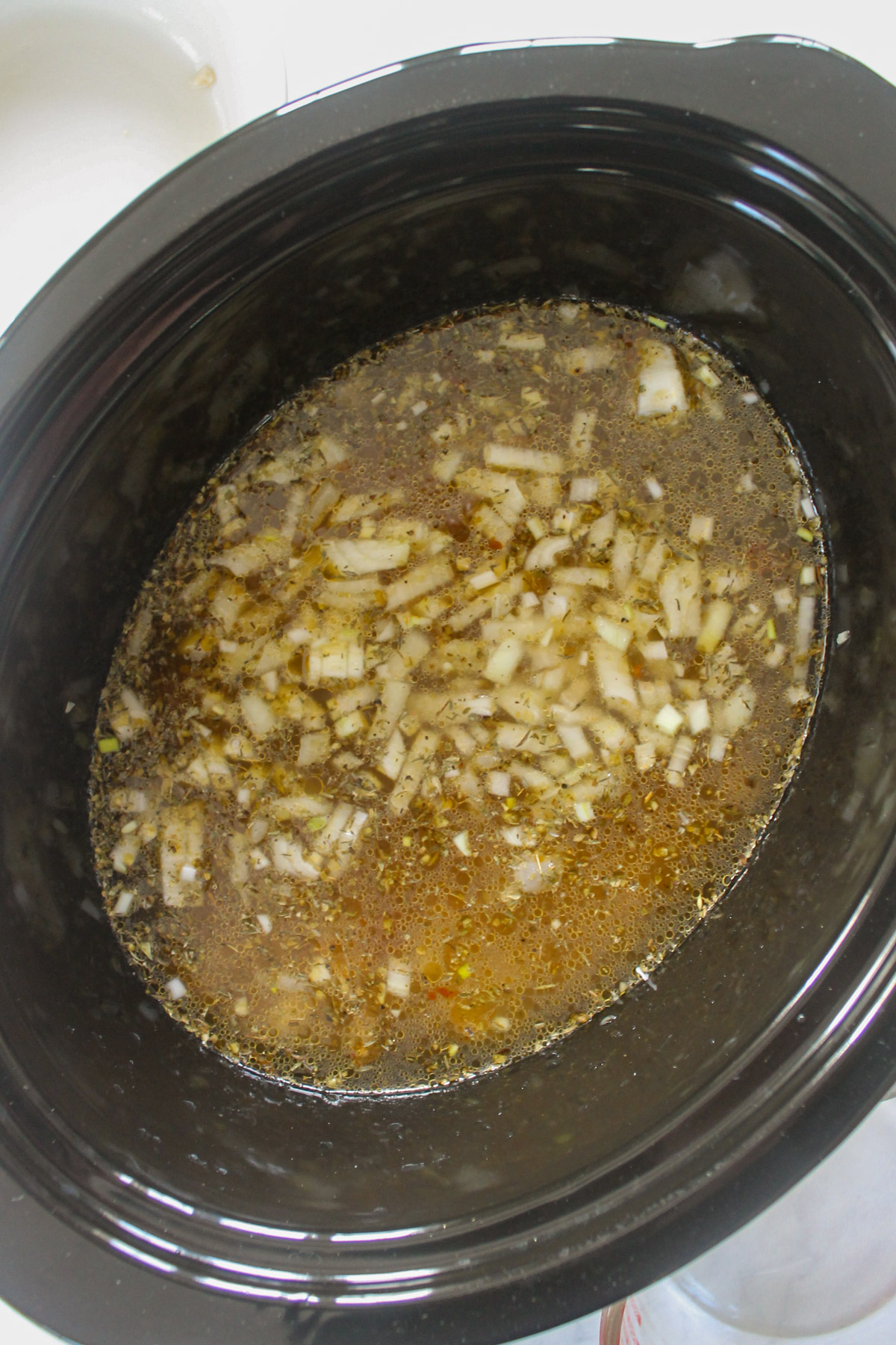 Chicken Gnocchi Soup starting in a slow cooker.