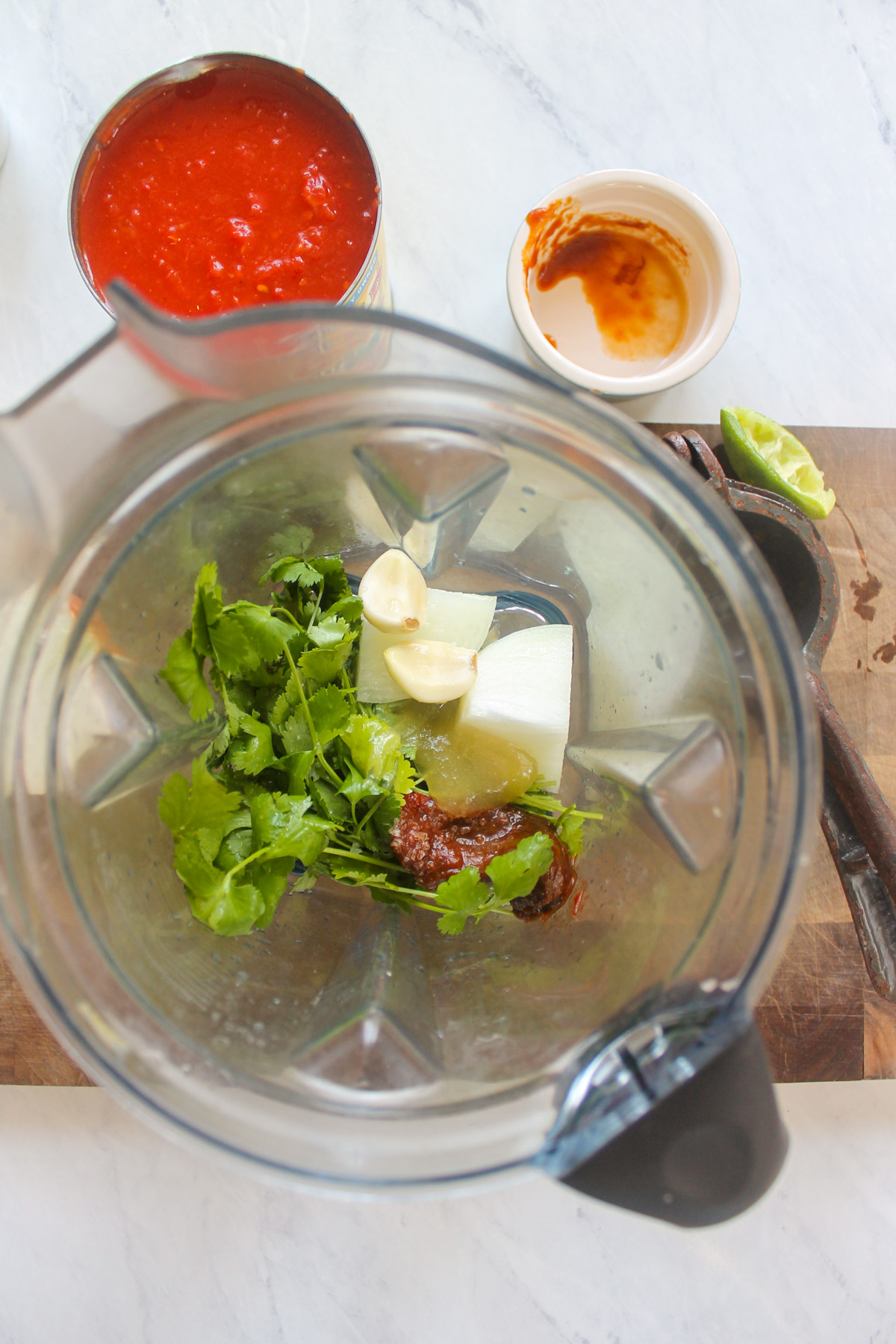 Cilantro, onion, garlic, chipotle peppers, lime juice and honey in a blender.