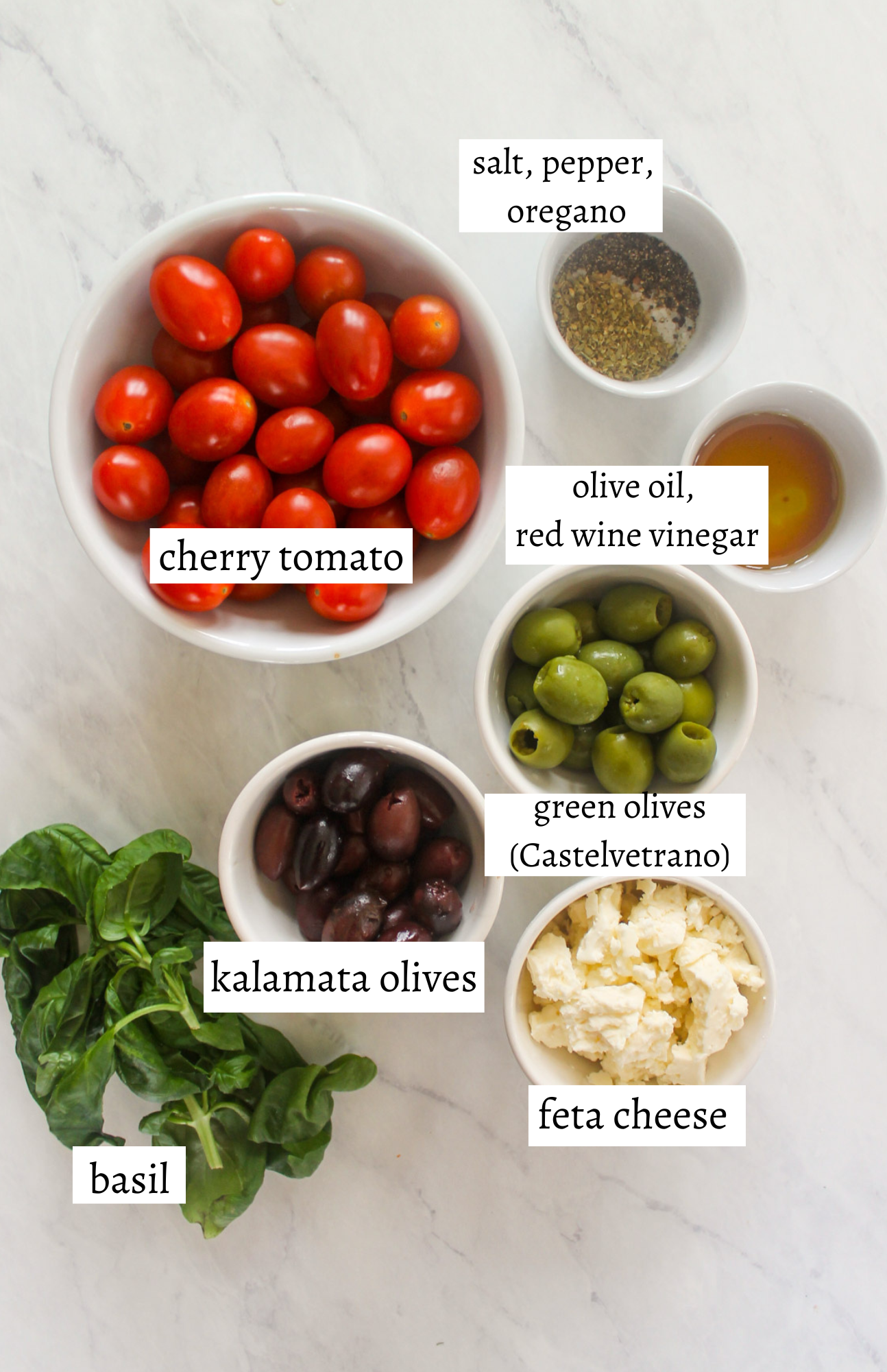 Labeled ingredients for Marinated Olives with Feta and Cherry Tomatoes.