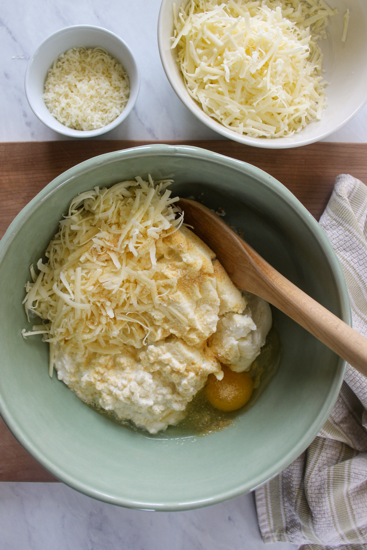 A bowl of cheese filling for stuffed shells.