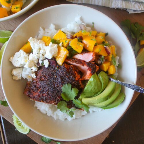 A rice bowl with blackened salmon and mango salsa.